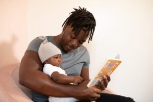 dad reading to baby dad reading to kid dad reading to child dad reading